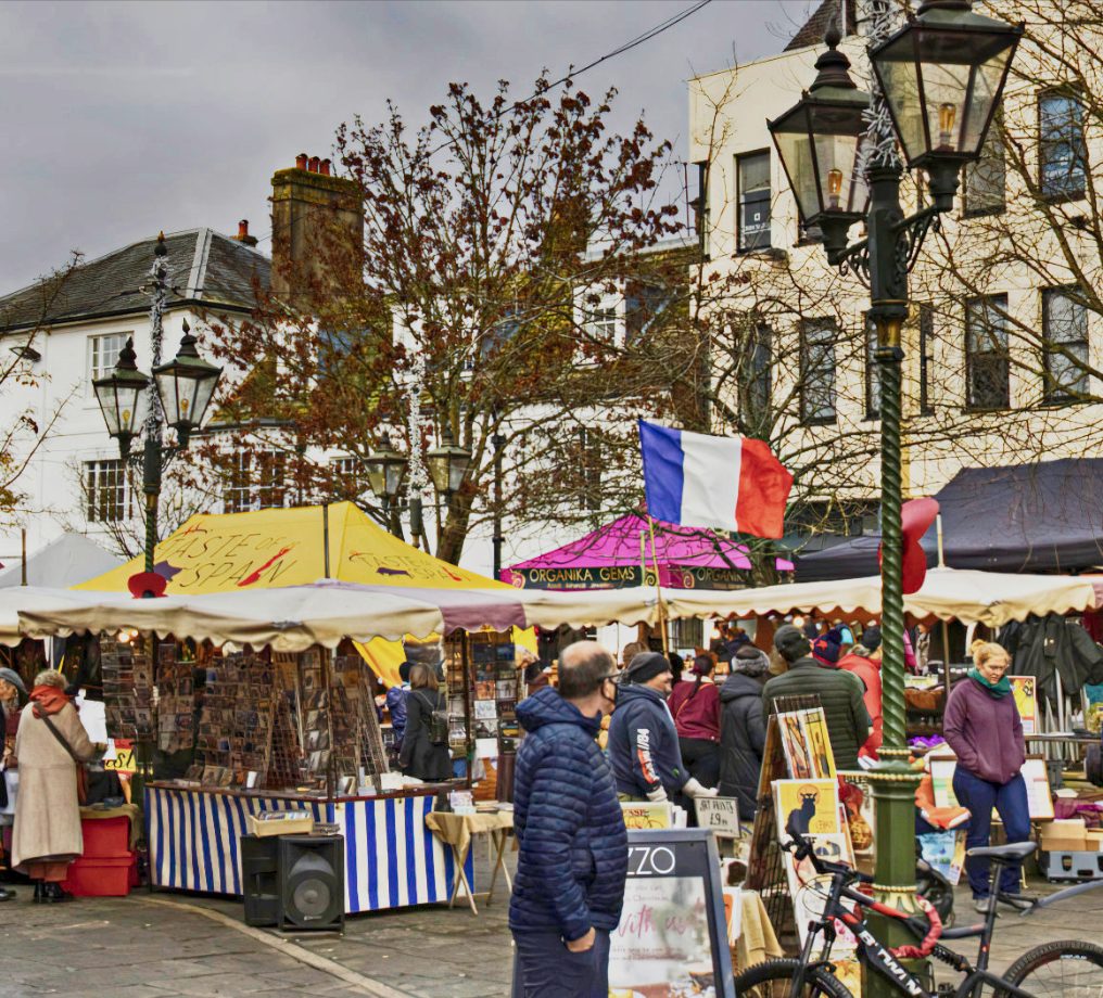 Striped stalls, a Taste of Spain canopy and a French flag in the Carfax